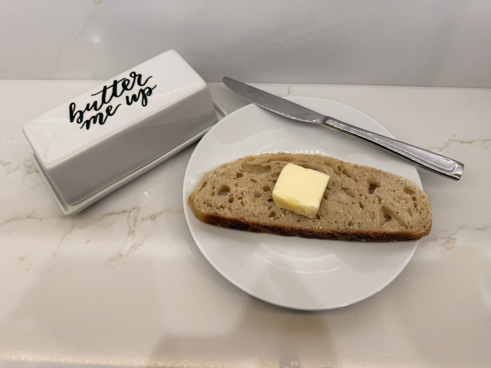 Fresh sourdough bread with butter — Belles Boutique & Bakery