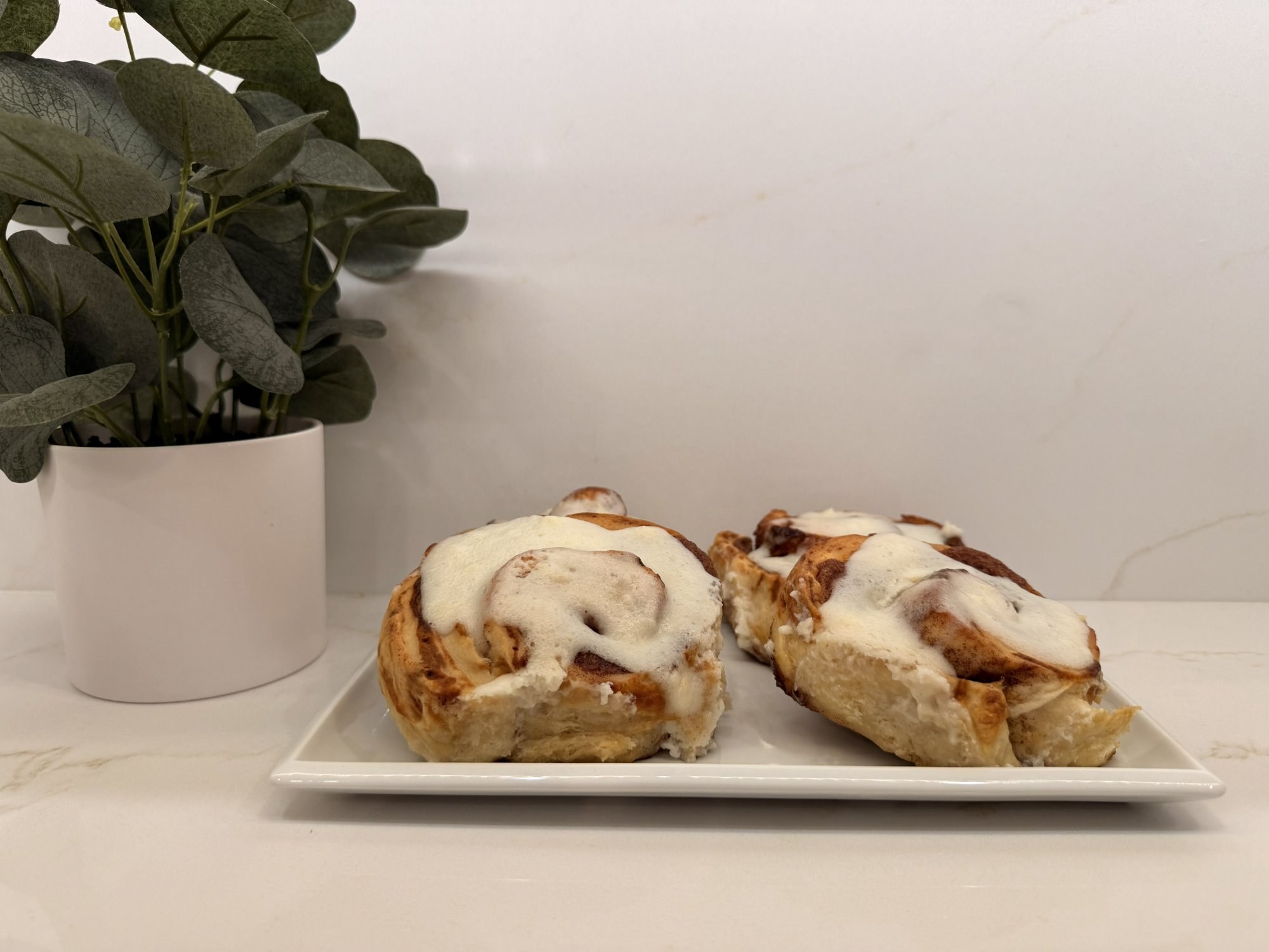 Sourdough cinnamon rolls with cinnamon sticks — Belles Boutique & Bakery